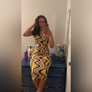 black, orange, yellow, blue, and peach colored strapless dress
